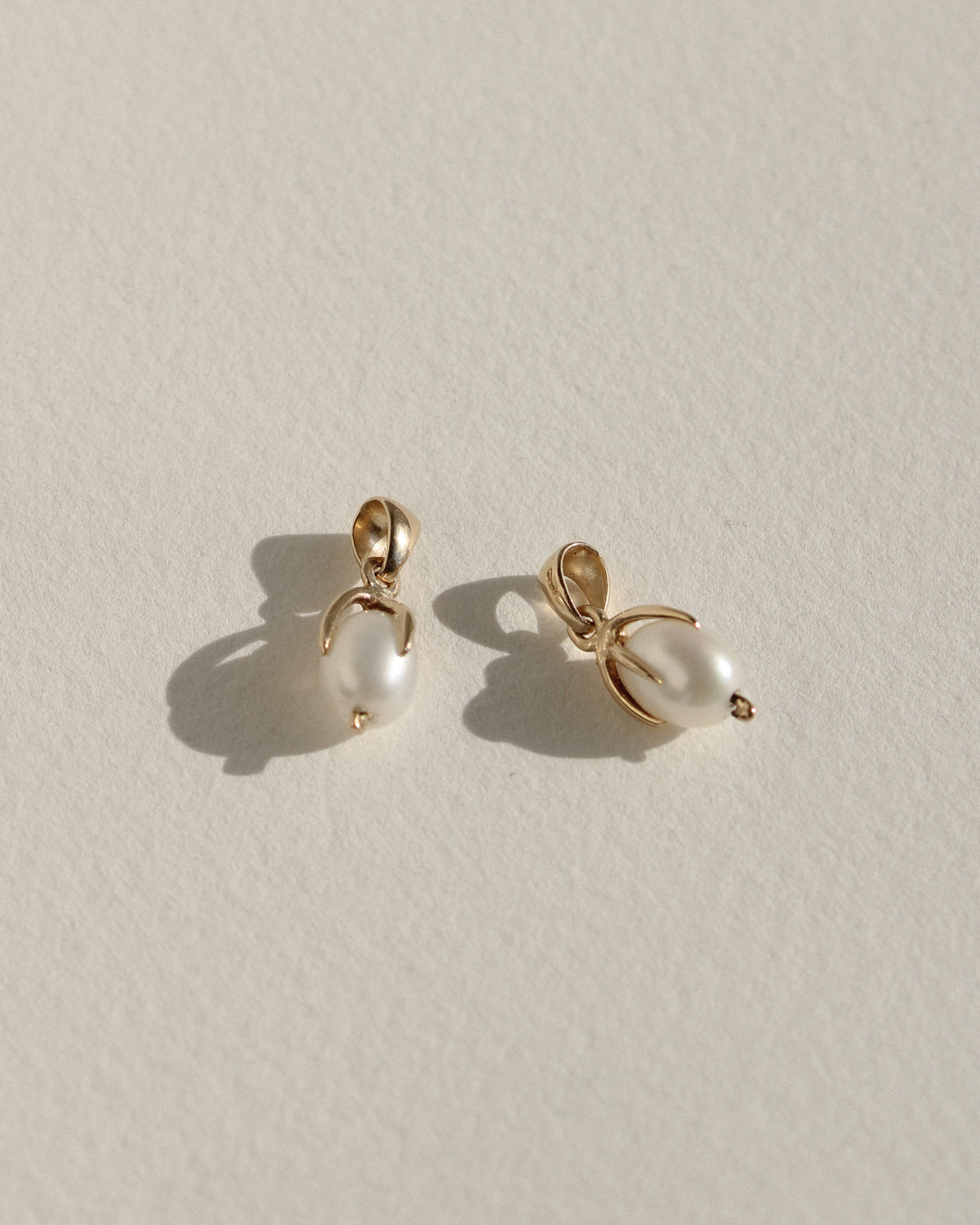 Clutched Pearl Charm