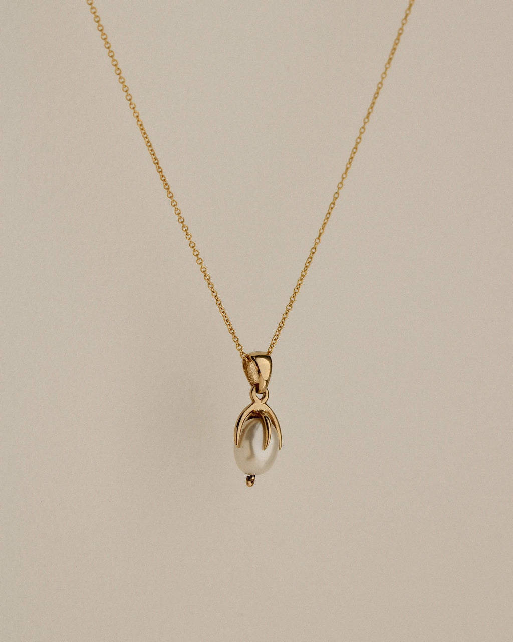 Clutched Pearl Charm