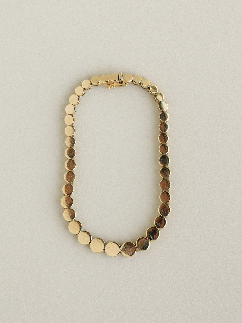 Graduated Disc Chain Bracelet